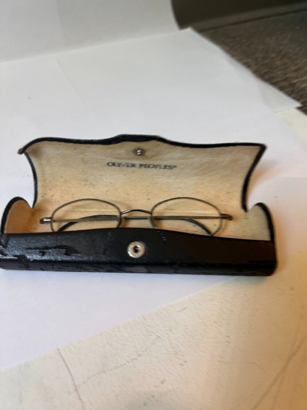 Oliver Peoples mens eye glasses, silver/gray metal.